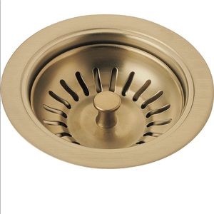 Delta faucet flange and strainer in honey bronze